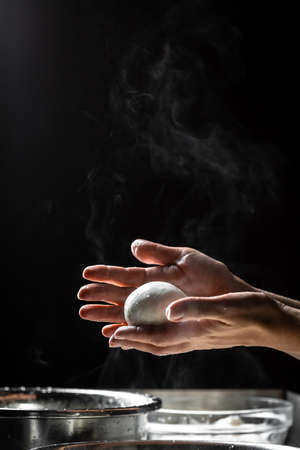 Cheesemaker showing freshly made mozzarella. The homemade cheese maker produces caciocavallo. Pasta...