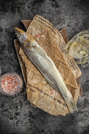 Sun fish dried, salted smelts on dark background. Snack for beer dried smelts. beer background....