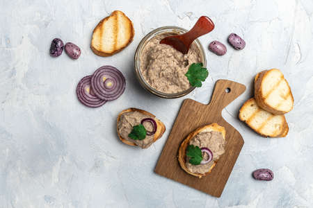 Toasts bread with beans paste, Mexican cuisine pate of beans in glass jar. healthy vegetarian food...