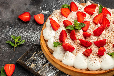 delicious strawberry tart pie or cake on a dark background. Home baking, organic food,の写真素材