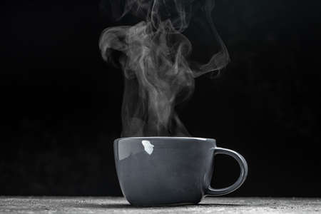 cup of coffee with steam on black background. hot drinks. hot steam with smoke, Culinary, cooking, concept.の写真素材