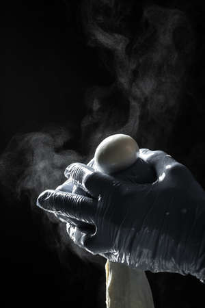 Production process of mozzarella cheese. woman working in a small family creamery is processing the final steps of making a cheese. Traditional Italian mozzarella.の写真素材