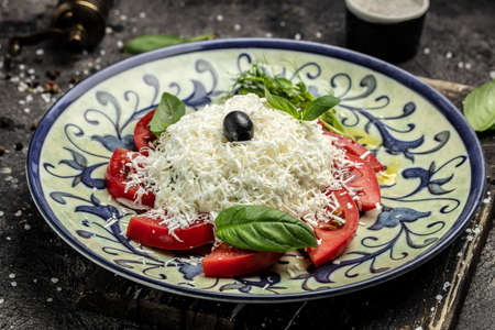 Fresh greek feta cheese salad served with tomatoes, Restaurant menu, dieting, cookbook recipe top view,の写真素材