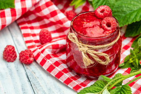 raspberry jam marmalade with fresh raspberries and mint. Organic Raspberries. redberry. banner, menu, recipe place for text, top view.の写真素材