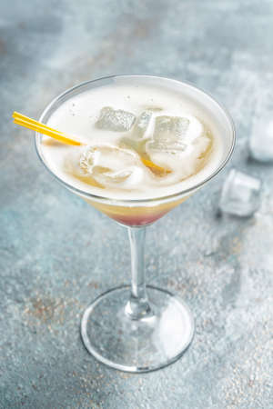 Classic daiquiri cocktail in glass on black background, Summer cold drink. cocktail allcohol. vertical image. top view. place for text,の写真素材