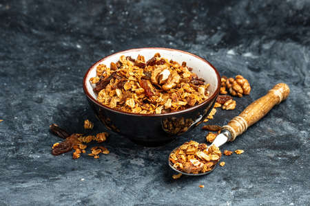 Bowl with granola on a blue background. superfood concept. Healthy, clean eating. Vegan or gluten free diet. Long banner format. top view.の写真素材