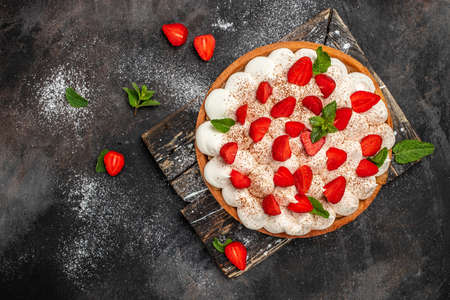 delicious strawberry tart pie or cake on a dark background. Home baking, organic food.の写真素材