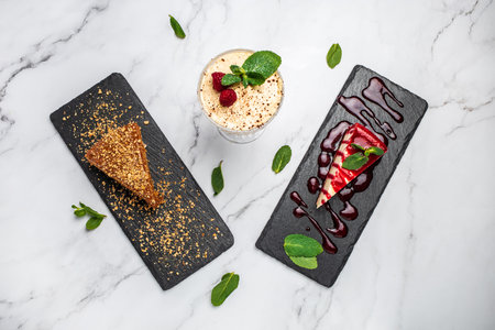Set Delicious dessert Piece of cheesecake with fresh strawberries jam and mint on a light...