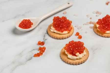 Salmon Red Caviar. Delicious snacks cracker, butter, salmon red caviar.の写真素材