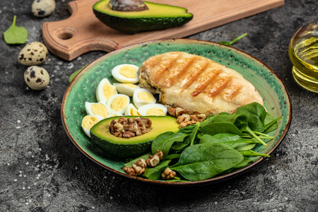 Chicken fillet with salad. Buddha Bowl on a dark background. Healthy food, keto diet, Healthy fats, clean eating for weight loss.の写真素材