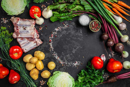 Ukrainian borsch ingredients. Fresh peeled vegetables and ribs, ingredients for borsch soup. banner, menu, recipe place for text, top view.の写真素材