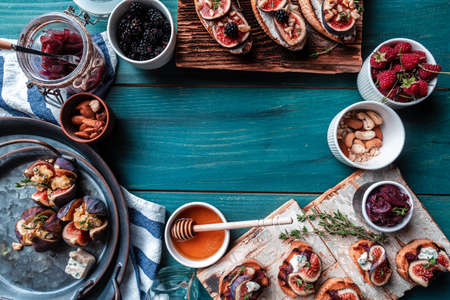 Figs stuffed with goat cheese. Figs with nut and honey cheese. Shallow dof. Figs with nut. blue cheese and honey. Delicious appetizer, ideal as an aperitif.の写真素材