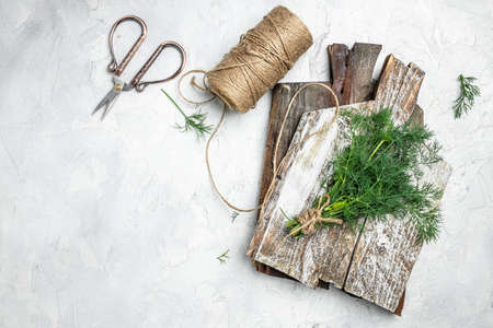 Fresh dill close up on wooden box on light background, preparation for freezing serving size organic healthy ething natural product portion. place for text.の写真素材