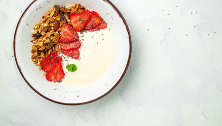 Crostini or toasts with strawberries and cream cheese ricotta. Delicious breakfast or snack, Clean eating, dieting, vegan food concept. top view.の写真素材