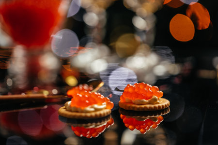 A close up view of a row of cracker and cream cheese canapes. Gourmet food close up, appetizer, selective focus, place for text.の写真素材