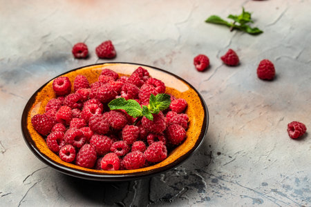 Organic raspberries, Fresh raspberries in bowl. Ripe juicy fresh raspberries. healthy food, vitamins, summer berry fruit. Long banner format. place for text,の写真素材