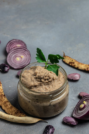 Toasts bread with beans paste, Mexican cuisine pate of beans in glass jar. healthy vegetarian food,...
