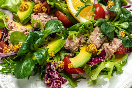 Close up tuna salad with lettuce, cherry tomatoes, avocado and red onions. superfood concept. Healthy, clean eating concept. Vegan or gluten free diet. top view.の写真素材