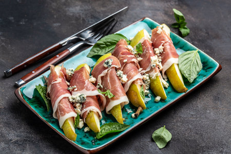 Appetizer with pear, blue cheese and prosciutto ham, Restaurant menu, dieting, cookbook recipe top view,の写真素材