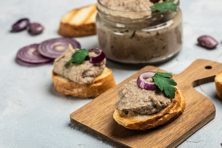 Homemade mushroom and bean paste. Mexican cuisine pate of beans, Pate in glass jar. Tasty sandwich. healthy vegetarian food, banner, menu, recipe place for text, top view,の写真素材