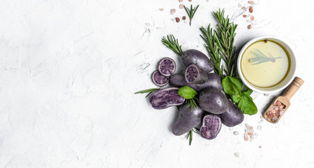 Raw cut purple sweet potatoes isolated on white background. Ipomoea batatas. Batata potatoes. Long banner format. top view.の写真素材