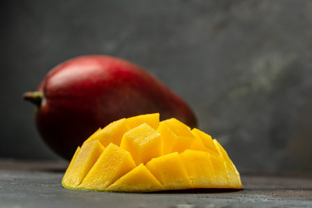 red mango. Fresh tropical fruits on a dark background. Long banner format.の写真素材