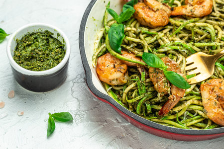 zucchini pasta with fried shrimps, cheese Parmesan in pan. Restaurant menu, dieting, cookbook recipe top view,の写真素材