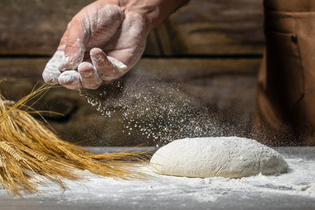 men hands with flour splash. cooking bread,の写真素材