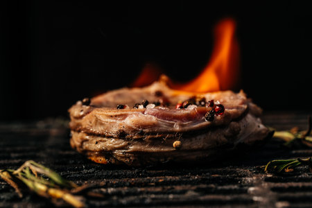 Beef steaks pieces of meat on the grill with flames. american cuisine. The concept cooking meat. Food recipe background. close up. place for text.の写真素材