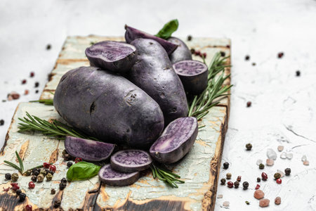 Organic purple sweet potato. Raw sweet potatoes or batatas. pomoea batatas. Batata potatoes. vegan food ingredient. banner, menu, recipe place for text, top view.の写真素材