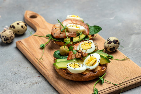 open sanwich with wholemeal bread, egg, spinach, avocado, shrimps, Ketogenic breakfast. superfood...