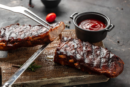 Grilled and smoked ribs with barbeque sauce. Delicious barbecued ribs. Food recipe background. close up.の写真素材