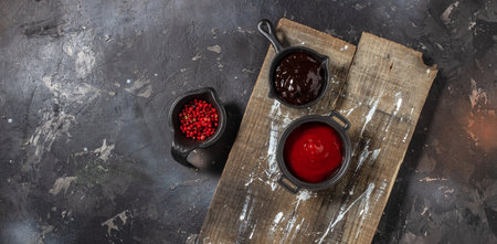 grilled barbeque sauce, with spices on a wooden background. cooking background. Long banner format. top view.の写真素材