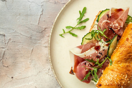 sandwich with arugula and jamon, Breakfast or brunch. Restaurant menu, dieting, cookbook recipe top view,の写真素材