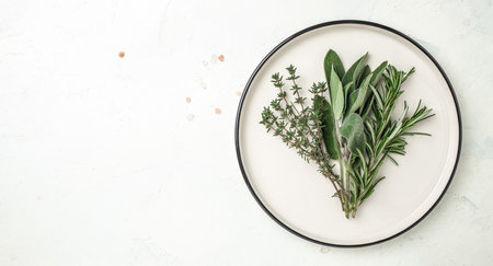 variety of fresh herbs rosemary, thyme and sage on plate. Long banner format. top view.の写真素材