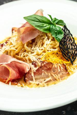 pasta carbonara Spaghetti with pancetta, egg, parmesan cheese and cream sauce. Traditional italian cuisine, Food recipe background. close up.の写真素材
