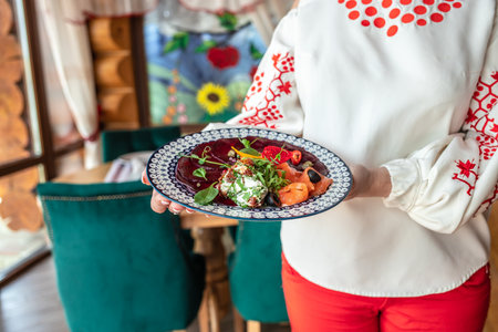 Woman hands holds appetizer salmon cream cheese beetroot, Delicious breakfast or snack, Clean...