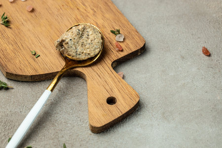mushrooms sauce, truffle paste on a wooden board. Clean eating, dieting, vegan food concept. top...