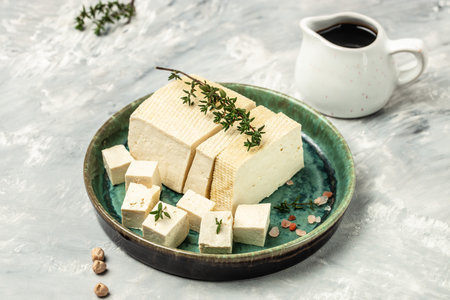 Tofu with bean on a light background, Culinary vegan and vegetarian eating, banner, menu, recipe place for text, top view,の写真素材