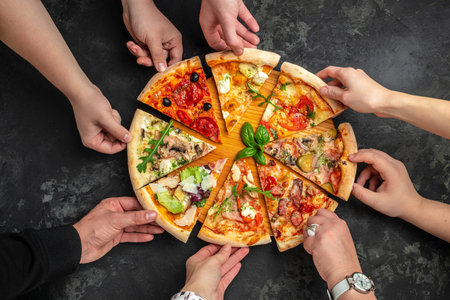 slices of pizza with different toppings, a hand holding a piece of pizza on a dark background, Restaurant menu, dieting, cookbook recipe top view,の写真素材