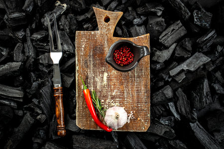 wooden board and ingredients for cooking background, place for text, top view,の写真素材