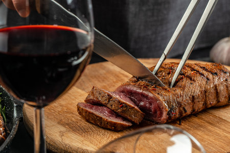 sliced beef grill steak with red wine. The concept of cooking meat,の写真素材
