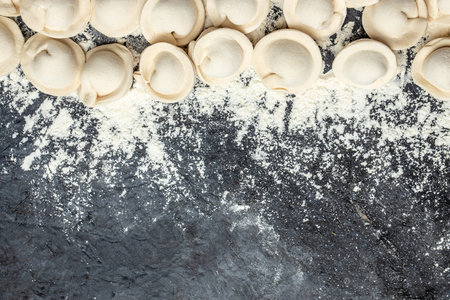 homemade raw pastry dumplings with meat filling. Pelmeni. banner, menu, recipe top view.の写真素材