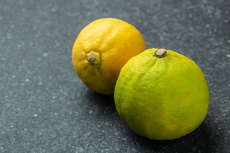 Fresh ripe bergamot fruits on a marble background. banner, menu, recipe place for text.の写真素材