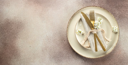 Spring table setting with white flowers, Long banner format. top view.