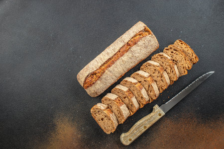 fresh dark buckwheat bread baguette. banner, menu, recipe place for text, top view.の写真素材