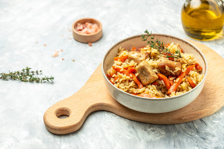 pilaf in a bowl, Uzbek dish. rice meat with vegetables. Restaurant menu, dieting, cookbook recipe top view.の写真素材