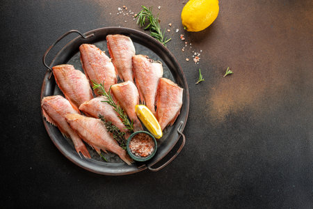 raw fish perch on a dark background. banner, menu, recipe place for text, top view,の写真素材
