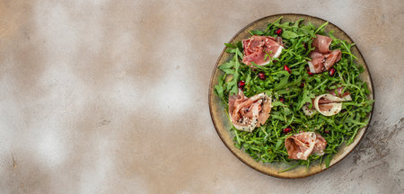 jamon, ham, rucola Salad Antipasto. Festive holiday food. Long banner format. top view.の写真素材