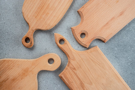Set of wooden chopping cutting boards on a light background. Handmade Charcuterie style serving boards. manual work. place for text, top view.の写真素材